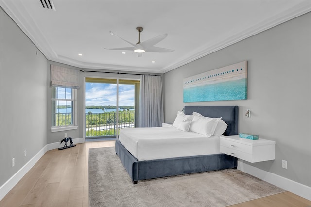 bedroom featuring hardwood / wood-style flooring, ceiling fan, crown molding, and access to outside