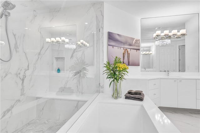 bathroom with vanity and tiled shower