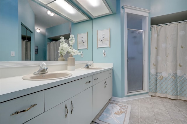 bathroom with vanity, tile patterned floors, and a shower with curtain