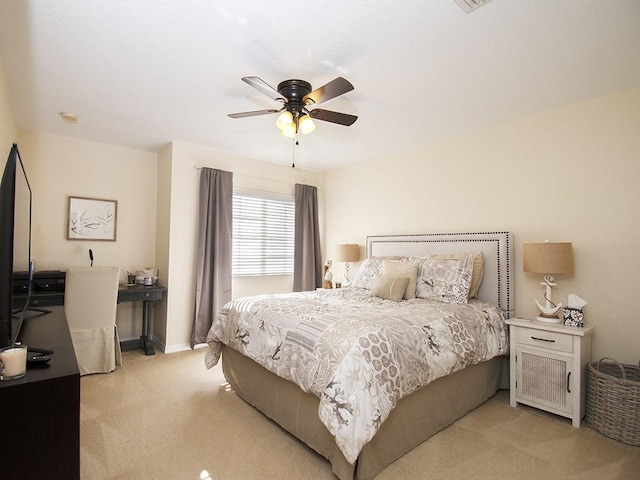 4368 56th Ln, Vero Beach, FL 32967 - bedroom with light carpet and a ceiling fan