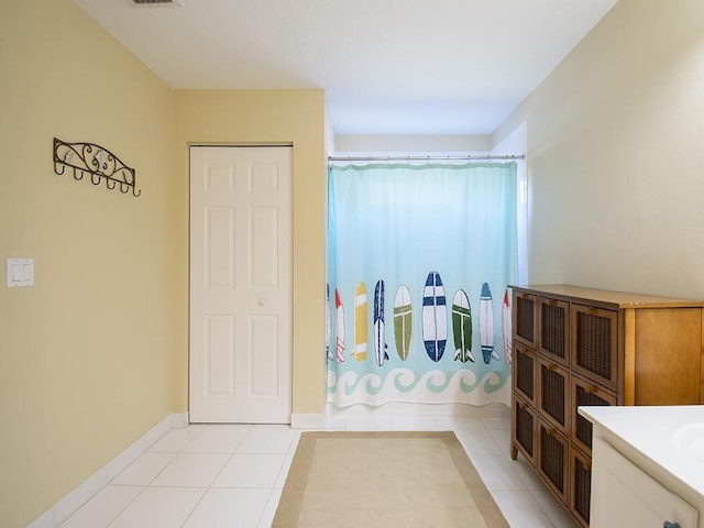 4368 56th Ln, Vero Beach, FL 32967 - full bath with tile patterned flooring, a shower with shower curtain, and vanity
