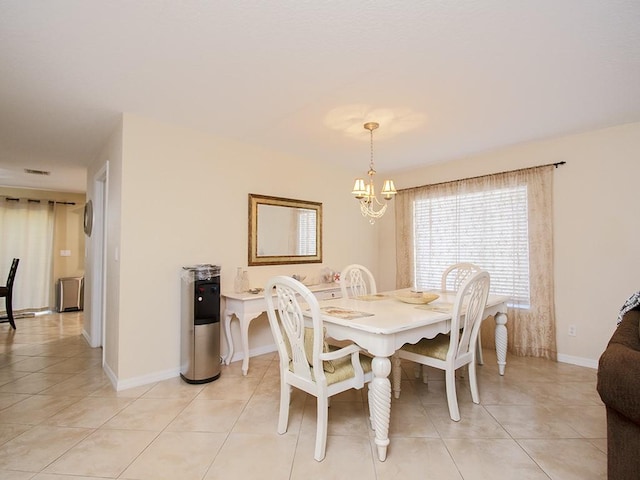 4368 56th Ln, Vero Beach, FL 32967 - dining room with a chandelier and light tile patterned floors