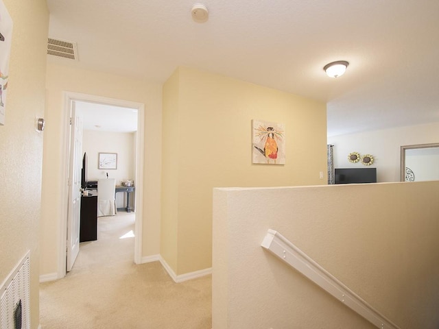 4368 56th Ln, Vero Beach, FL 32967 - corridor with an upstairs landing and light colored carpet