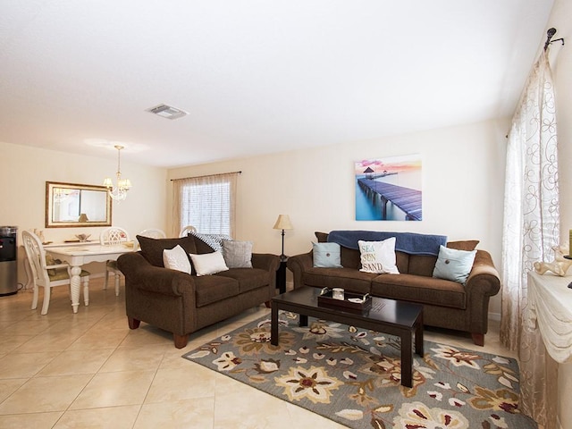 4368 56th Ln, Vero Beach, FL 32967 - living area with a chandelier and light tile patterned floors