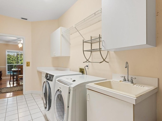 laundry room with cabinets, separate washer and dryer, ceiling fan, and light tile patterned flooring