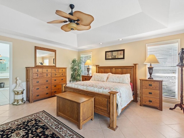 tiled bedroom with a raised ceiling, ensuite bath, crown molding, and ceiling fan