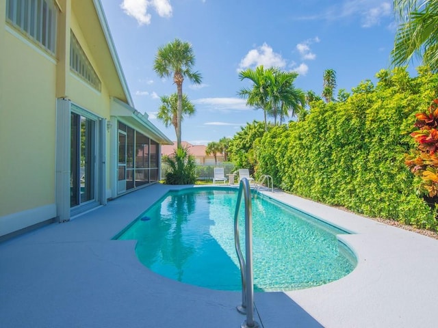 view of pool featuring a patio