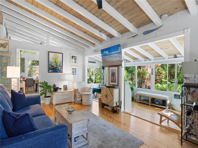 living room featuring hardwood / wood-style floors, lofted ceiling with beams, and wooden ceiling