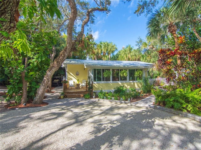 single story home featuring a wooden deck