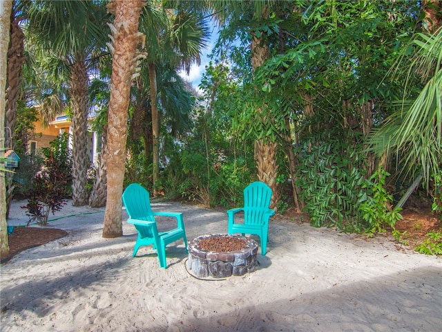 view of patio with an outdoor fire pit