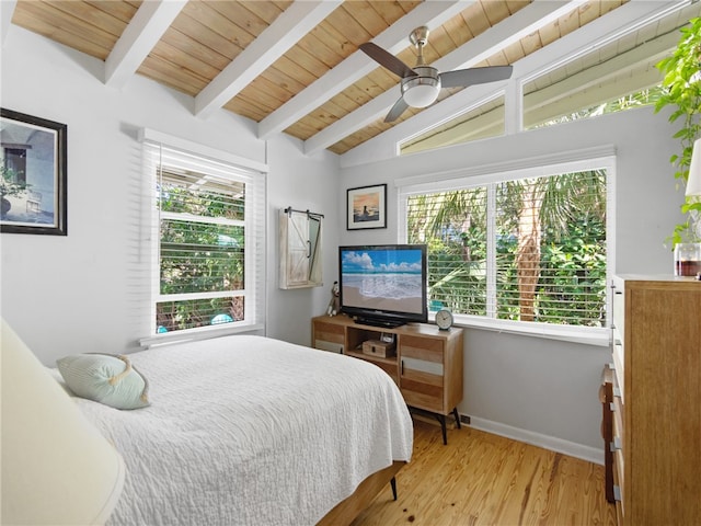 bedroom with vaulted ceiling with beams, light hardwood / wood-style flooring, ceiling fan, and wooden ceiling