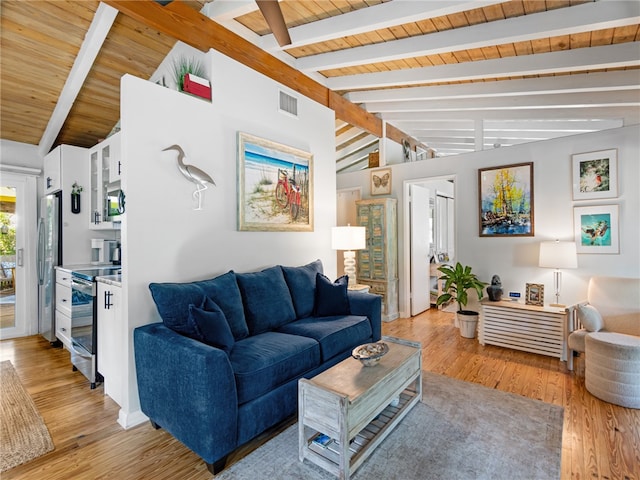 living room featuring vaulted ceiling with beams, light wood-type flooring, and wood ceiling