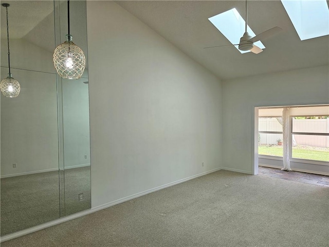 542 9th Pl, Vero Beach, FL 32960 - carpeted spare room featuring a skylight, high vaulted ceiling, and ceiling fan