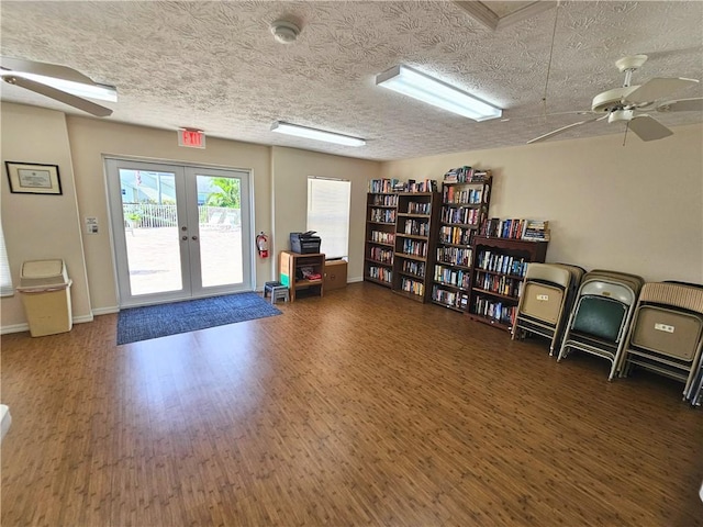 542 9th Pl, Vero Beach, FL 32960 - office with ceiling fan, french doors, wood finished floors, and a textured ceiling