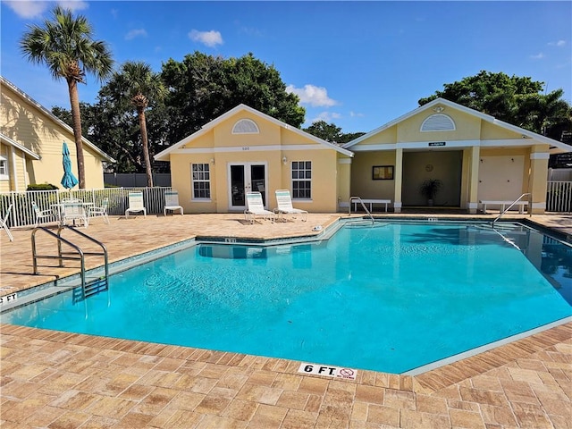 542 9th Pl, Vero Beach, FL 32960 - community pool with a patio area and french doors