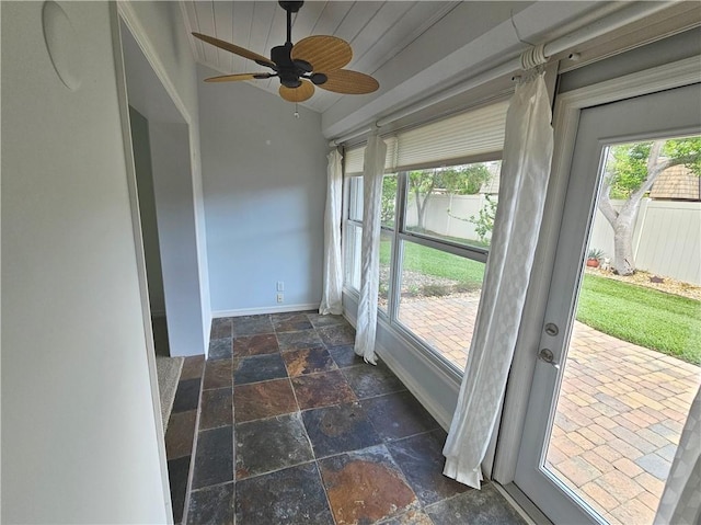 542 9th Pl, Vero Beach, FL 32960 - unfurnished sunroom featuring stone tile floors and baseboards