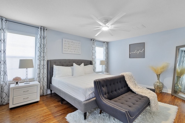 bedroom featuring hardwood / wood-style flooring and ceiling fan