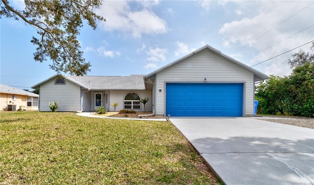 ranch-style home featuring cooling unit, a garage, and a front lawn