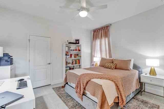 bedroom featuring baseboards and ceiling fan