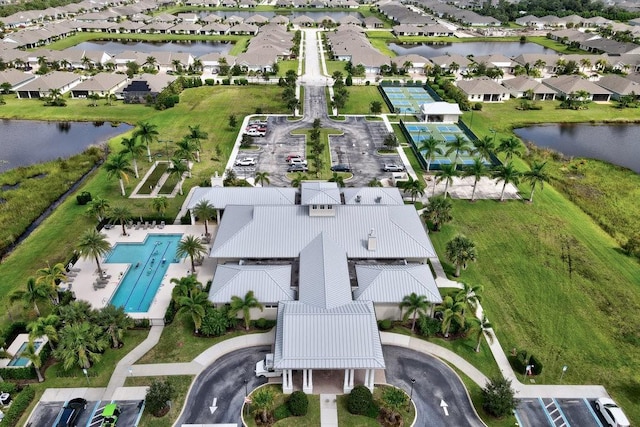 birds eye view of property with a residential view and a water view