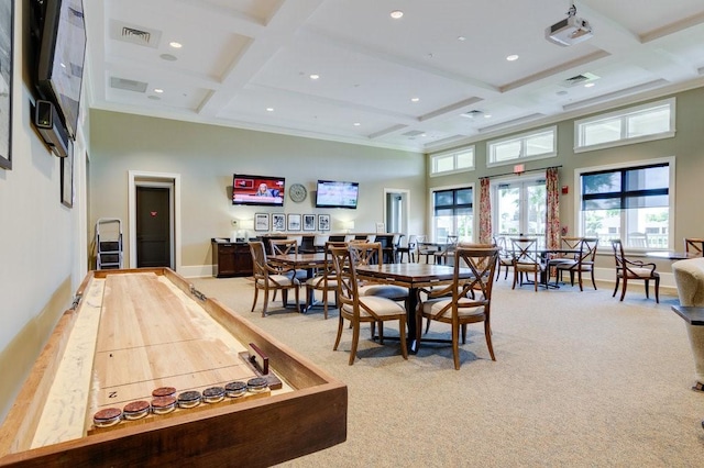 dining room with visible vents, beam ceiling, coffered ceiling, and a towering ceiling