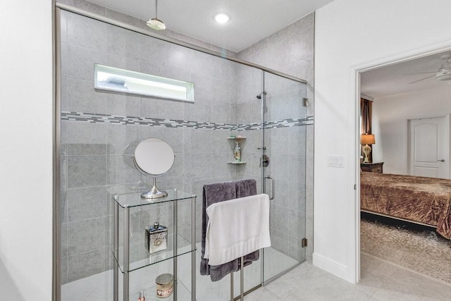 ensuite bathroom with tile patterned floors, a shower stall, and connected bathroom