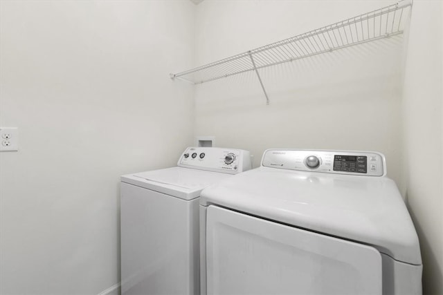 washroom featuring washing machine and dryer