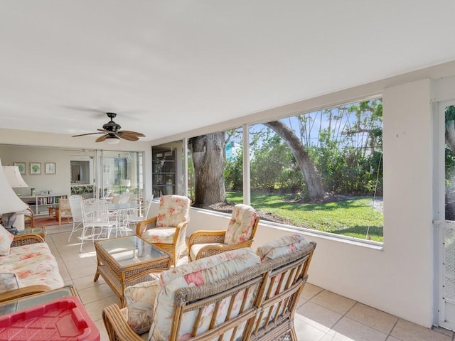 sunroom featuring ceiling fan