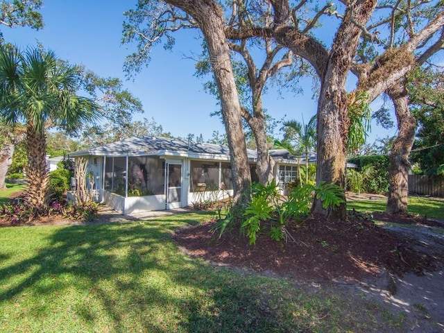 view of yard featuring a sunroom