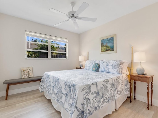 bedroom featuring light hardwood / wood-style floors and ceiling fan