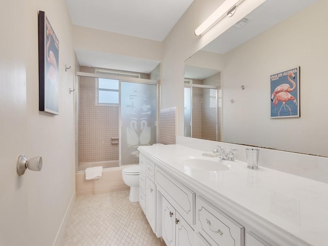 full bathroom with vanity, toilet, and shower / bath combination with glass door