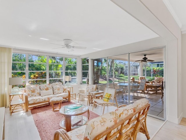 sunroom with ceiling fan and a healthy amount of sunlight