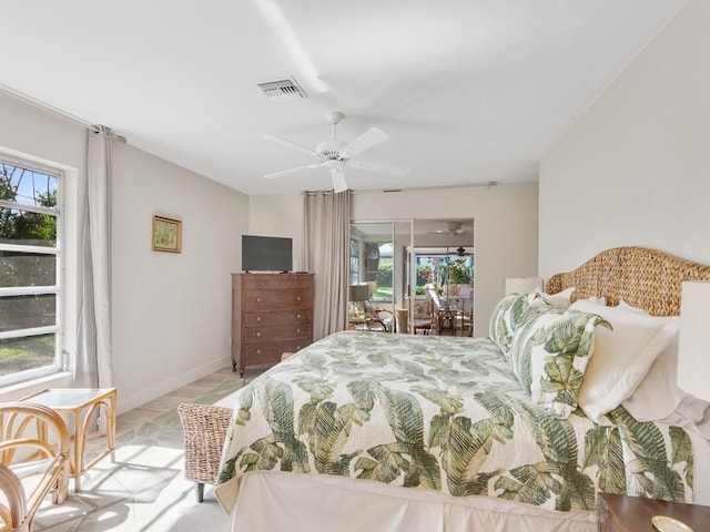 bedroom with access to outside, multiple windows, ceiling fan, and light hardwood / wood-style floors