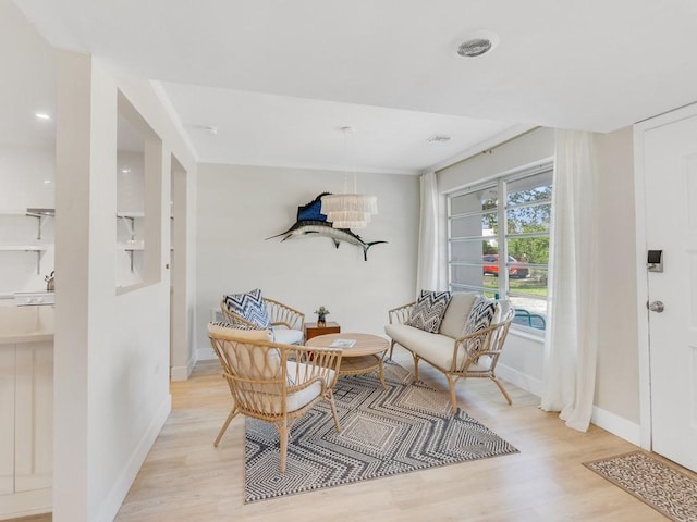 sitting room with light hardwood / wood-style flooring