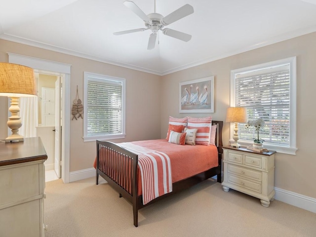 bedroom with light colored carpet, multiple windows, and baseboards