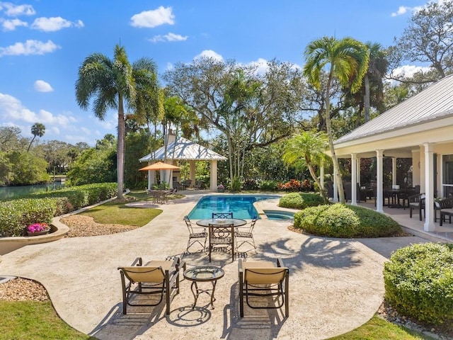 outdoor pool featuring a gazebo and a patio