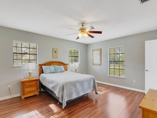 bedroom featuring hardwood / wood-style floors and ceiling fan