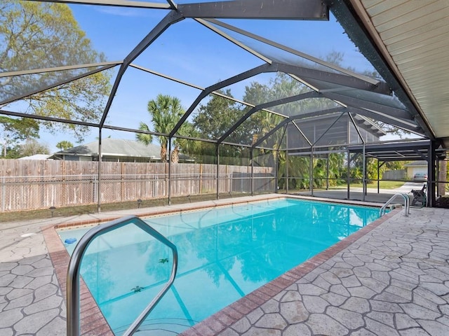 view of pool featuring a lanai and a patio