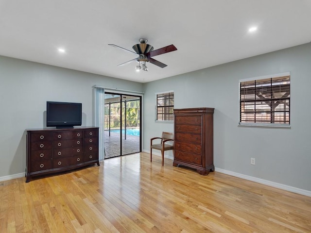 sitting room featuring ceiling fan and light wood-type flooring