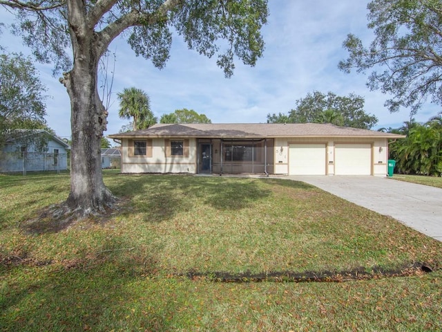 single story home featuring a garage and a front yard