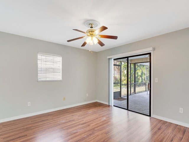 empty room featuring ceiling fan and light wood-type flooring