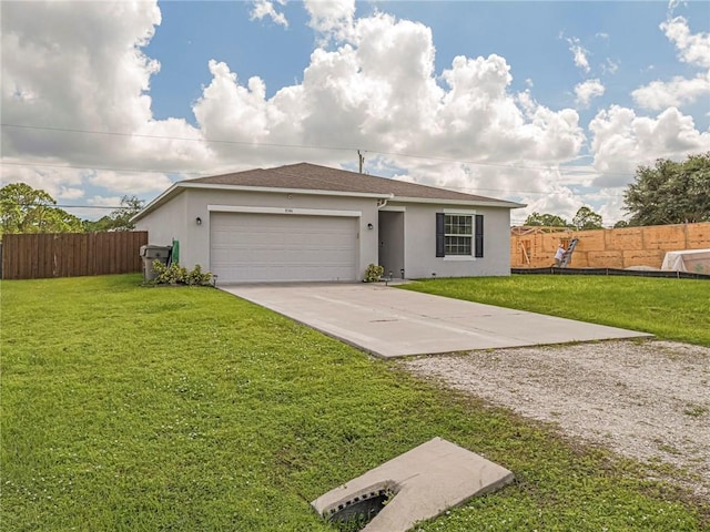 single story home with a garage and a front lawn