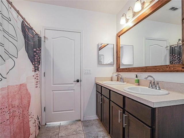 bathroom featuring vanity and tile patterned flooring