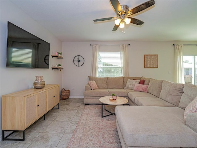 living room with ceiling fan and light tile patterned floors