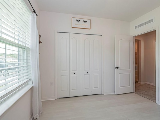 unfurnished bedroom featuring a closet