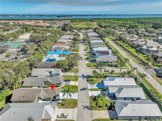 birds eye view of property with a water view