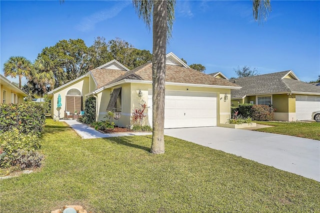 view of front facade featuring a garage and a front lawn