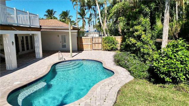 view of pool with a patio area and french doors