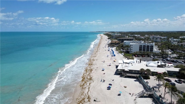 birds eye view of property with a view of the beach and a water view