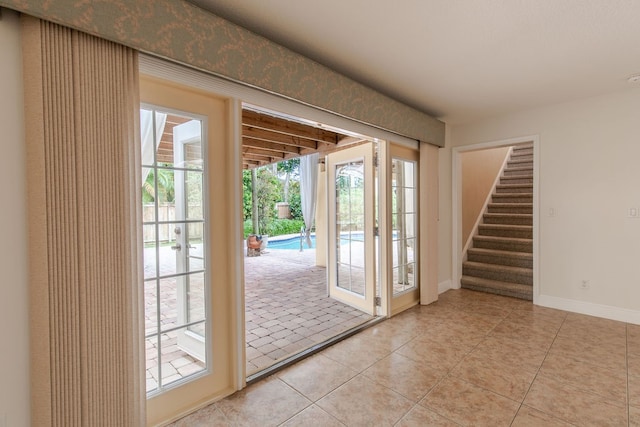 doorway featuring light tile patterned floors